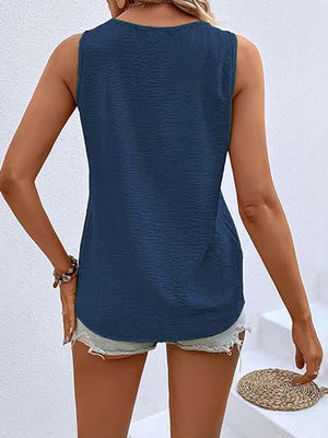 Dark blue textured sleeveless V-neck top with button front detail.