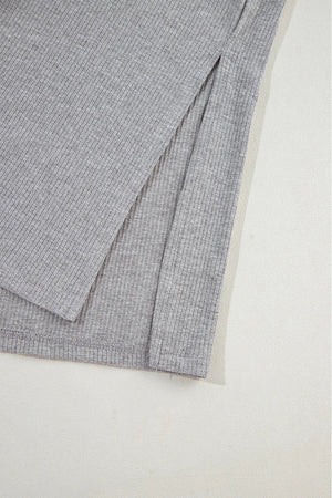 Gray ribbed knit lounge set detail showing a side slit on the garment.
