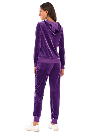Purple velvet loungewear set with hoodie and drawstring pants.
