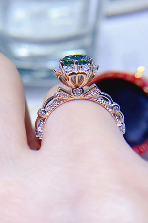 Emerald Bloom Moissanite Halo Ring in light green with pave diamond band and heart details.