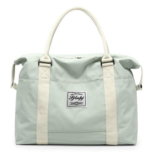 Light Green travel duffel bag with cream straps and a central logo patch.