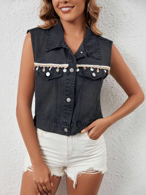 Black denim vest with decorative trim and shell details, cropped length