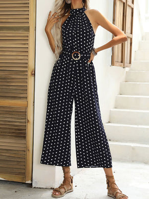 Navy polka dot wide-leg romper with halter neck and belted waist
