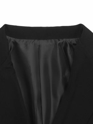 Black double-breasted blazer with satin lining and sculpted fit.