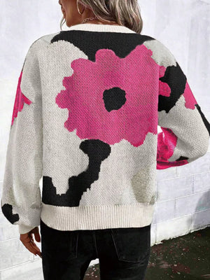 Abstract floral knit sweater with round neck in hot pink & black.