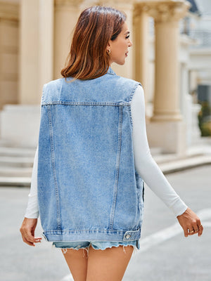 Light blue oversized denim vest with utility pockets, buttoned front, and a relaxed fit.