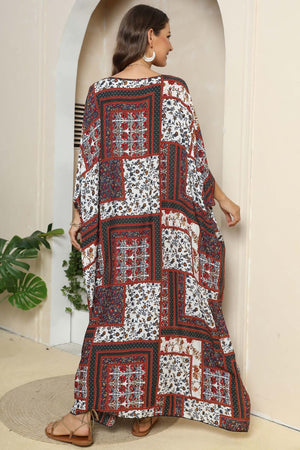 Patchwork caftan maxi dress in mixed floral prints and deep red, white, and navy.