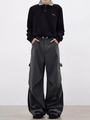 Men's grey pinstripe wide-leg sweatpants with pockets and a relaxed fit.