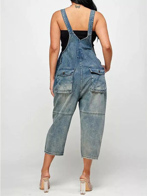 Light blue denim overalls with button front, adjustable straps, and multiple pockets.
