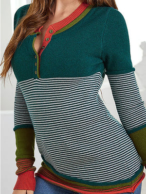 Colorblock henley knit shirt with stripes, button neck, and contrast cuffs.