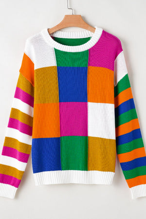 Patchwork knit crewneck pullover sweater with colorful blocks and striped sleeves.