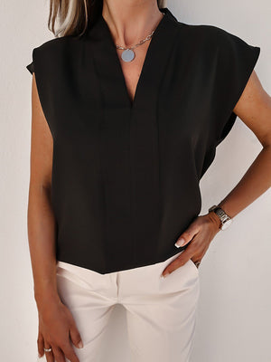 Black V-neck sleeveless blouse with vertical seams and a relaxed fit.