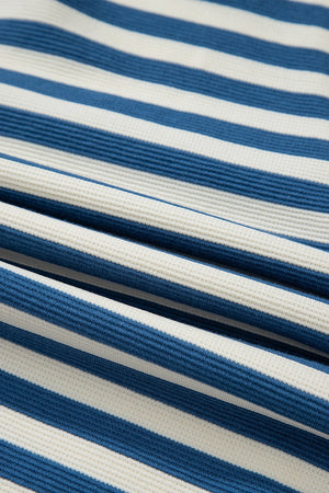 Textured stripe henley top in peacock blue and white with a waffle knit fabric detail.