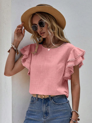 Dusty Pink ruffle sleeve blouse with pom-pom trim and round neckline.