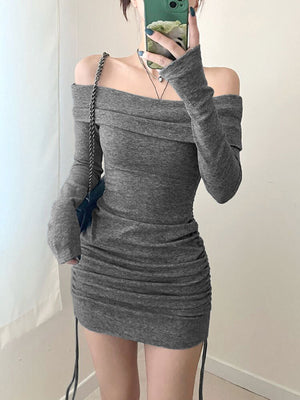 Grey ruched bodycon mini dress with off-the-shoulder neckline and drawstring detail.