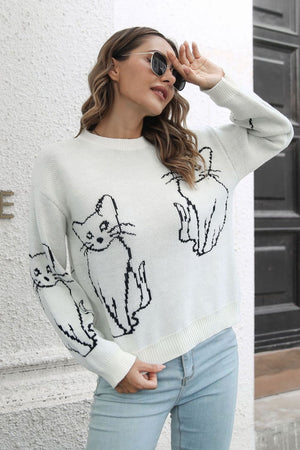White acrylic sweater with black cat intarsia knit motif, crew neck, long sleeves.