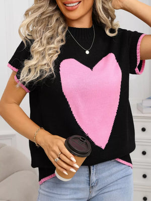 Black acrylic knit top with pink heart graphic and ribbed accents.