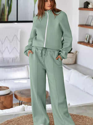 Sage cotton zip-up jacket and drawstring pants set with white zipper detail.