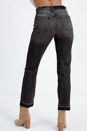 Maternity jeans in charcoal wash denim with distressed frayed hem.