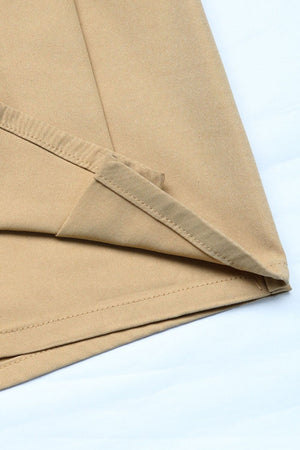 Tan skort shorts with visible pleats and stitching details.