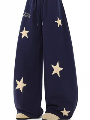 Navy wide leg sweatpants with drawstring and embroidered stars