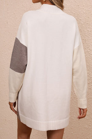 Geometric colorblock knit mini dress in ivory with camel and light blue sleeves.