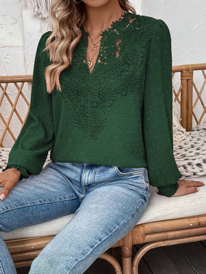 Dark green blouse with lace yoke and puff sleeves, textured fabric