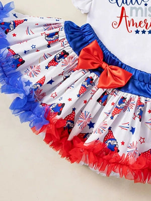 Baby outfit set with gnome and firework print skirt, red bow, and ruffled trim.