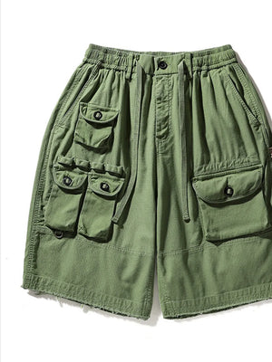Green cargo shorts with multiple pockets and drawstring waist