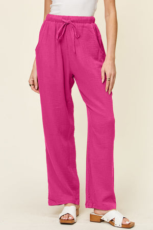 Textured gauze relaxed drawstring trousers in hot pink with pockets