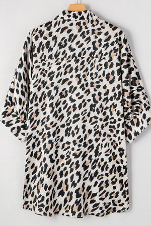 Leopard print oversized button-down blouse with cuffed sleeves.