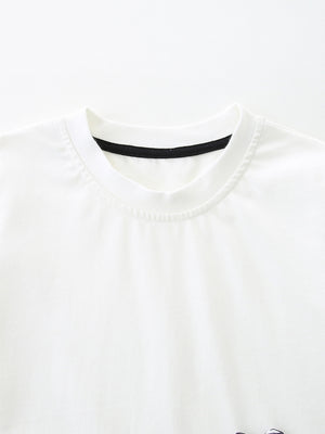 White cotton baby tee with black trim neckline, part of a zebra graphic set.