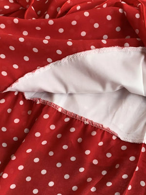 Red polka dot dress with white lining detail