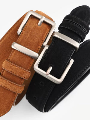 Luxurious cowhide leather belts in black and brown with silver buckles.