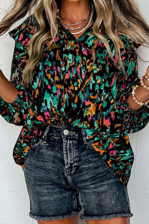 Ruffled Aura Sleeve Blouse in abstract print with V-neck and long sleeves.