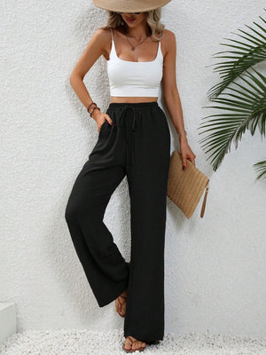 Black textured palazzo trousers with drawstring waist and wide leg