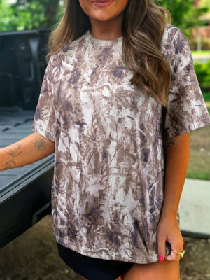 Woodland camouflage drop shoulder tunic with crew neck and short sleeves.