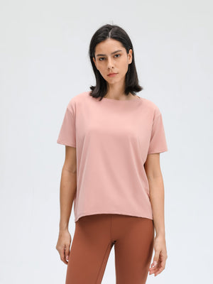 Relaxed fit performance tee in dusty rose pink with short sleeves and crew neck.