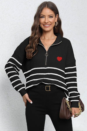 Black striped knit sweater with zip neck and red heart patch detail