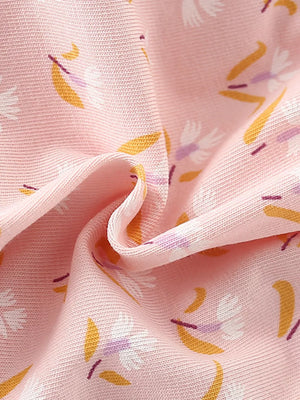 Toddler dress fabric with a pink floral print, cotton blend, showing ruffle detail.