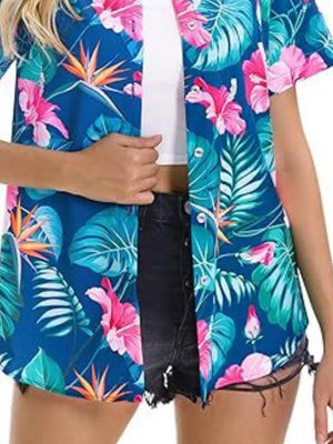 Tropical hibiscus print button-up shirt in blue with short sleeves and a relaxed fit.