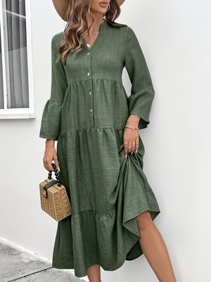 Tiered midi dress in olive green cotton blend with button front, bell sleeves, and ruffled hem.