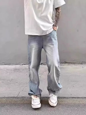 Relaxed fit light wash distressed wide leg jeans in cotton blend.