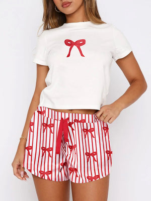 White tee with red bow graphic and red striped lounge shorts with bow print