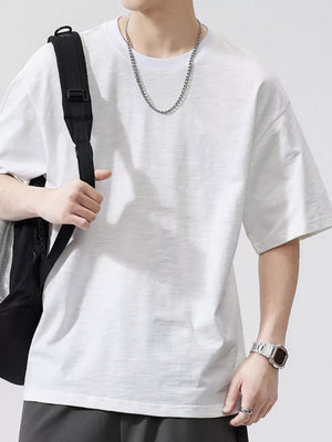 Men's white relaxed fit cotton t-shirt with crew neck and short sleeves.
