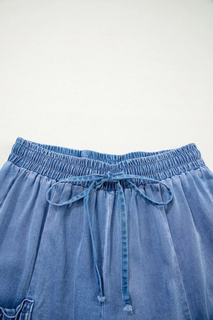 Relaxed denim maternity jeans with elastic drawstring waist and tie detail.