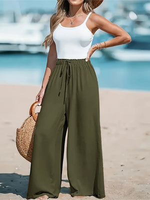 Moss wide-leg drawstring trousers with a relaxed fit and flowy silhouette.
