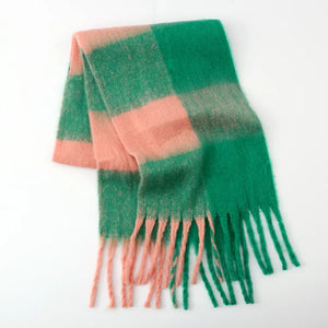 Fluffy plaid scarf in green and pink with fringe detail.