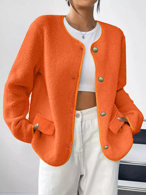 Orange textured button-up fleece jacket with round neckline and patch pockets