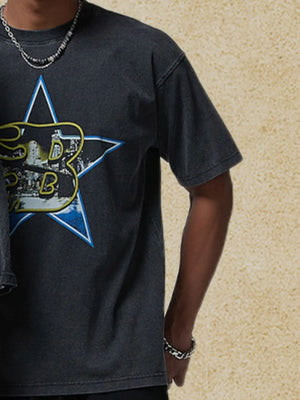 Black graphic t-shirt with a vintage star design and short sleeves.